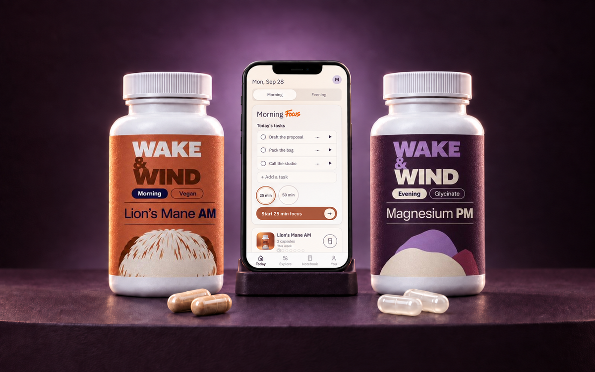 Lion's Mane AM and Magnesium PM bottles with the Wake & Wind app on a phone and capsules from each bottle